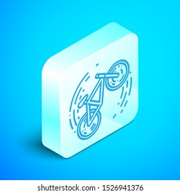 Isometric line Bicycle trick icon isolated on blue background. Bike race. Extreme sport. Sport equipment. Silver square button. Vector Illustration