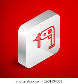 Isometric line Electric drill machine icon isolated on red background. Repair tool. Silver square button. Vector Illustration