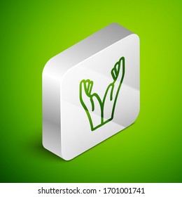 Isometric line Hands in praying position icon isolated on green background. Prayer to god with faith and hope. Silver square button. Vector Illustration