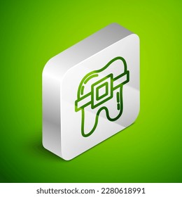 Isometric line Teeth with braces icon isolated on green background. Alignment of bite of teeth, dental row with with braces. Dental concept. Silver square button. Vector