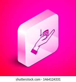 Isometric Money on hand icon isolated on pink background. Palm holds cash with down. Cash salary decrease. Silver square button. Vector Illustration