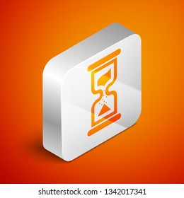 Isometric Old hourglass with flowing sand icon isolated on orange background. Sand clock sign. Business and time management concept. Silver square button. Vector Illustration