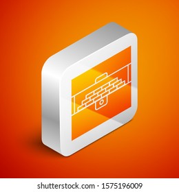 Isometric Opened antique treasure chest icon isolated on orange background. Vintage wooden chest with golden coin. Silver square button. Vector Illustration