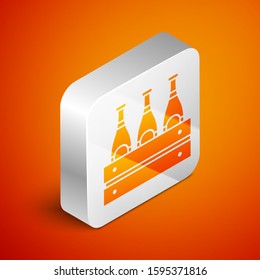 Isometric Pack of beer bottles icon isolated on orange background. Wooden box and beer bottles. Case crate beer box sign. Silver square button. Vector Illustration