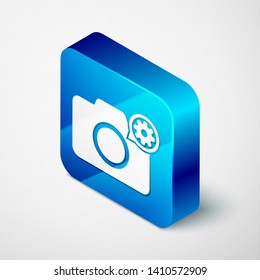 Isometric Photo camera and gear icon isolated on white background. Adjusting app, service concept, setting options, maintenance, repair, fixing. Blue square button. Vector Illustration
