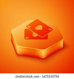 Isometric Playing cards icon isolated on orange background. Casino gambling. Orange hexagon button. Vector Illustration