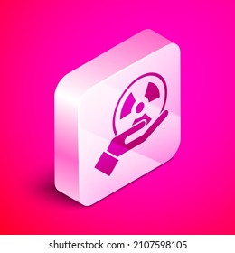 Isometric Radioactive in hand icon isolated on pink background. Radioactive toxic symbol. Radiation Hazard sign. Silver square button. Vector