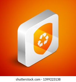 Isometric Recycle symbol inside shield icon isolated on orange background. Eco protection sign. Silver square button. Vector Illustration