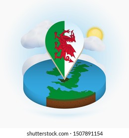 Isometric round map of Wales and point marker with flag of Wales. Cloud and sun on background. Isometric vector illustration.