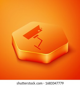 Isometric Security camera icon isolated on orange background. Orange hexagon button. Vector Illustration