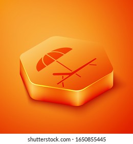 Isometric Sunbed icon isolated on orange background. Beach umbrella and Sun lounger. Orange hexagon button. Vector Illustration