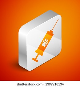 Isometric Syringe with pet vaccine icon isolated on orange background. Dog or cat paw print. Silver square button. Vector Illustration