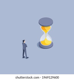 isometric vector illustration on gray background, a man in a business suit looks at the running time in an hourglass