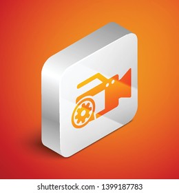 Isometric Video camera and gear icon isolated on orange background. Adjusting app, service concept, setting options, maintenance, repair, fixing. Silver square button. Vector Illustration