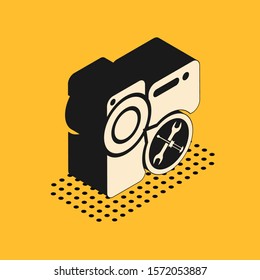 Isometric Video camera with screwdriver and wrench icon isolated on yellow background. Adjusting, service, setting, maintenance, repair, fixing.  Vector Illustration