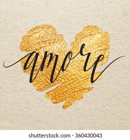 Italian Valentines day card. Amore calligraphy lettering with gold paint heart on craft background. Hand drawn letters.