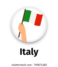 Italy flag in hand, round icon with shadow isolated on white. Human hand holding flag, vector illustration