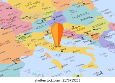 Italy with orange placeholder pin on europe map, close up Italy, vacation and road trip concept, pinned destination, travel idea, top view, colorful map with location icon