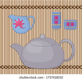 Items for a Chinese tea ceremony on a bamboo mat.