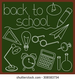 items for school on a green blackboard background