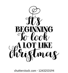 "It's Beginning to look a lot like Christmas" - Calligraphy phrase for Christmas. Hand drawn lettering for Xmas greetings cards, invitations. Good for t-shirt, mug, scrap booking, gift, printing press