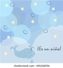 "It's a boy" in Spanish language. Es un nino . Baby Boy Birth announcement card, label, greeting, congratulation.Cute whale announces arrival of baby boy. Blue Background with blue bubbles and stars. 