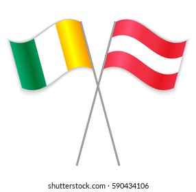 Ivorian and Austrian crossed flags. Ivory Coast combined with Austria isolated on white. Language learning, international business or travel concept.