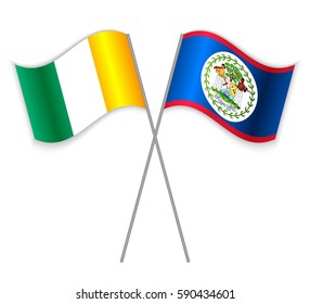 Ivorian and Belizean crossed flags. Ivory Coast combined with Belize isolated on white. Language learning, international business or travel concept.