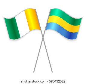 Ivorian and Gabonese crossed flags. Ivory Coast combined with Gabon isolated on white. Language learning, international business or travel concept.