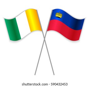 Ivorian and Liechtenstein crossed flags. Ivory Coast combined with Liechtenstein isolated on white. Language learning, international business or travel concept.