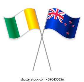 Ivorian and NZ crossed flags. Ivory Coast combined with New Zealand isolated on white. Language learning, international business or travel concept.
