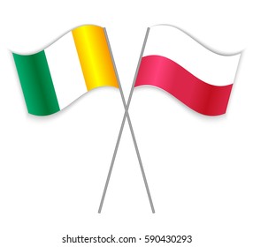 Ivorian and Polish crossed flags. Ivory Coast combined with Poland isolated on white. Language learning, international business or travel concept.