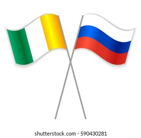 Ivorian and Russian crossed flags. Ivory Coast combined with Russia isolated on white. Language learning, international business or travel concept.
