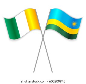 Ivorian and Rwandan crossed flags. Ivory Coast combined with Rwanda isolated on white. Language learning, international business or travel concept.