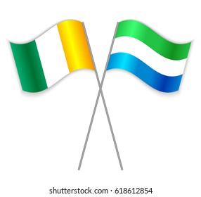 Ivorian and Sierra Leonean crossed flags. Ivory Coast combined with Sierra Leone isolated on white. Language learning, international business or travel concept.