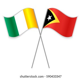 Ivorian and Timorese crossed flags. Ivory Coast combined with East Timor isolated on white. Language learning, international business or travel concept.