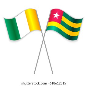 Ivorian and Togolese crossed flags. Ivory Coast combined with Togo isolated on white. Language learning, international business or travel concept.