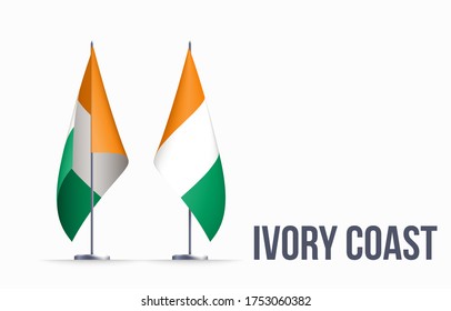 Ivory Coast flag state symbol isolated on background national banner. Greeting card National Independence Day of the Republic of Côte d'Ivoire. Illustration banner with realistic state flag.