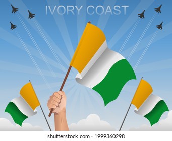 The ivory Coast flags flutter under the blue sky