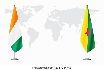 Ivory Coast and French Guiana flags for official meeting against background of world map.