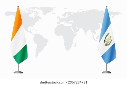 Ivory Coast and Guatemala flags for official meeting against background of world map.