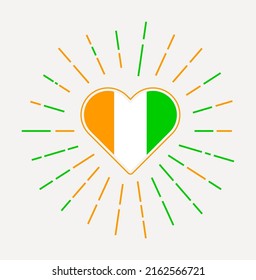 Ivory Coast heart with flag of the country. Sunburst around Ivory Coast heart sign. Vector illustration.