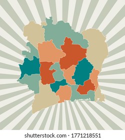 Ivory Coast map. Poster with map of the country in retro color palette. Shape of Ivory Coast with sunburst rays background. Vector illustration.