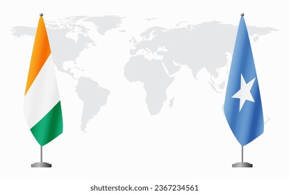 Ivory Coast and Somalia flags for official meeting against background of world map.