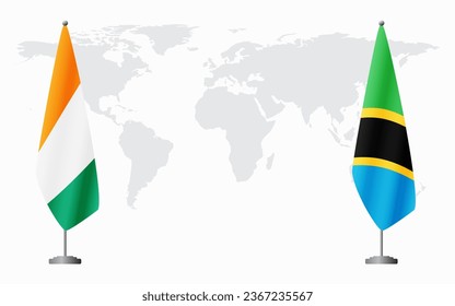 Ivory Coast and Tanzania flags for official meeting against background of world map.