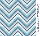 ixelated chevron of blue and white mosaic cells. Vector decor suitable for print and decoration.