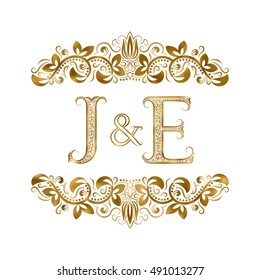 J and E vintage initials logo symbol. The letters are surrounded by ornamental elements. Wedding or business partners monogram in royal style.