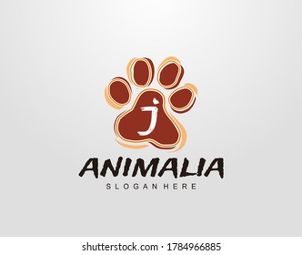J Letter in Paw Shape Design. Pet logo design. Dog, Cat, animal clinic, pet care center. Paw vector logo Icon Template.