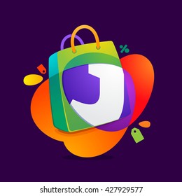 J letter with shopping bag icon and Sale tag. 