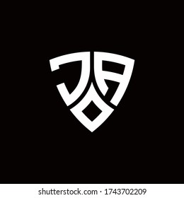 JA monogram logo with modern shield style design template isolated on black background